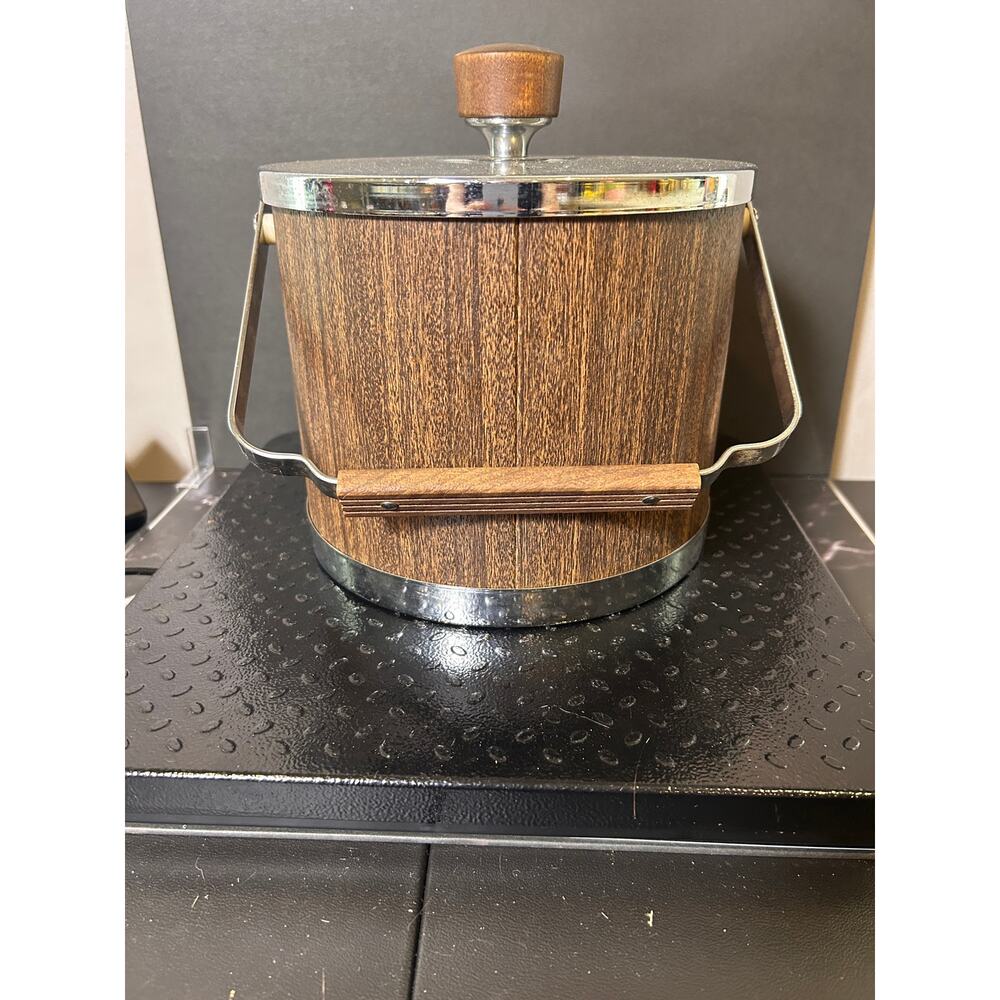 vintage Mid-Century Modern Kromex ice bucket featuring a faux wood grain body
